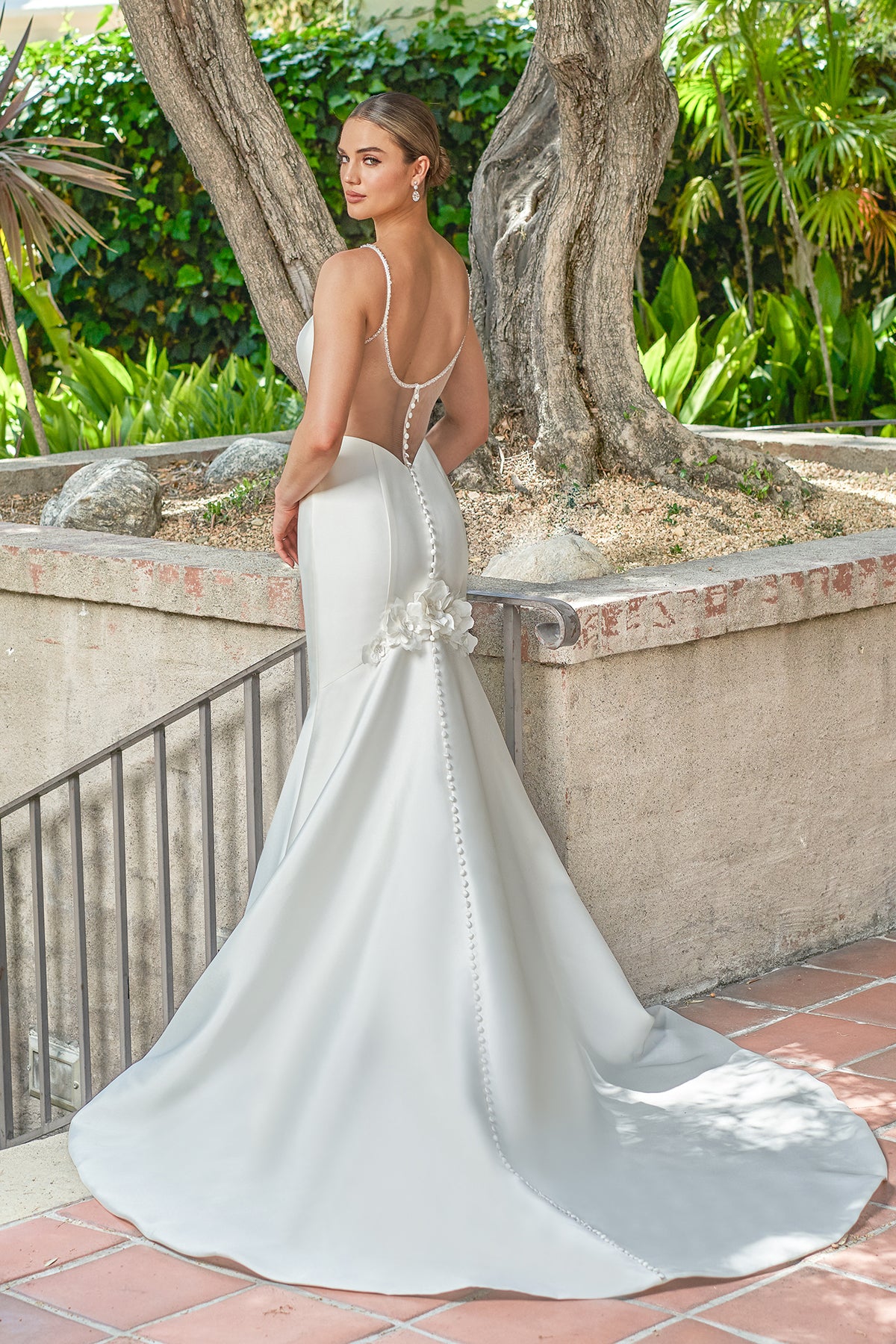 Thin shoulder strap backless waist cinched mermaid and ground trailing wedding dress
