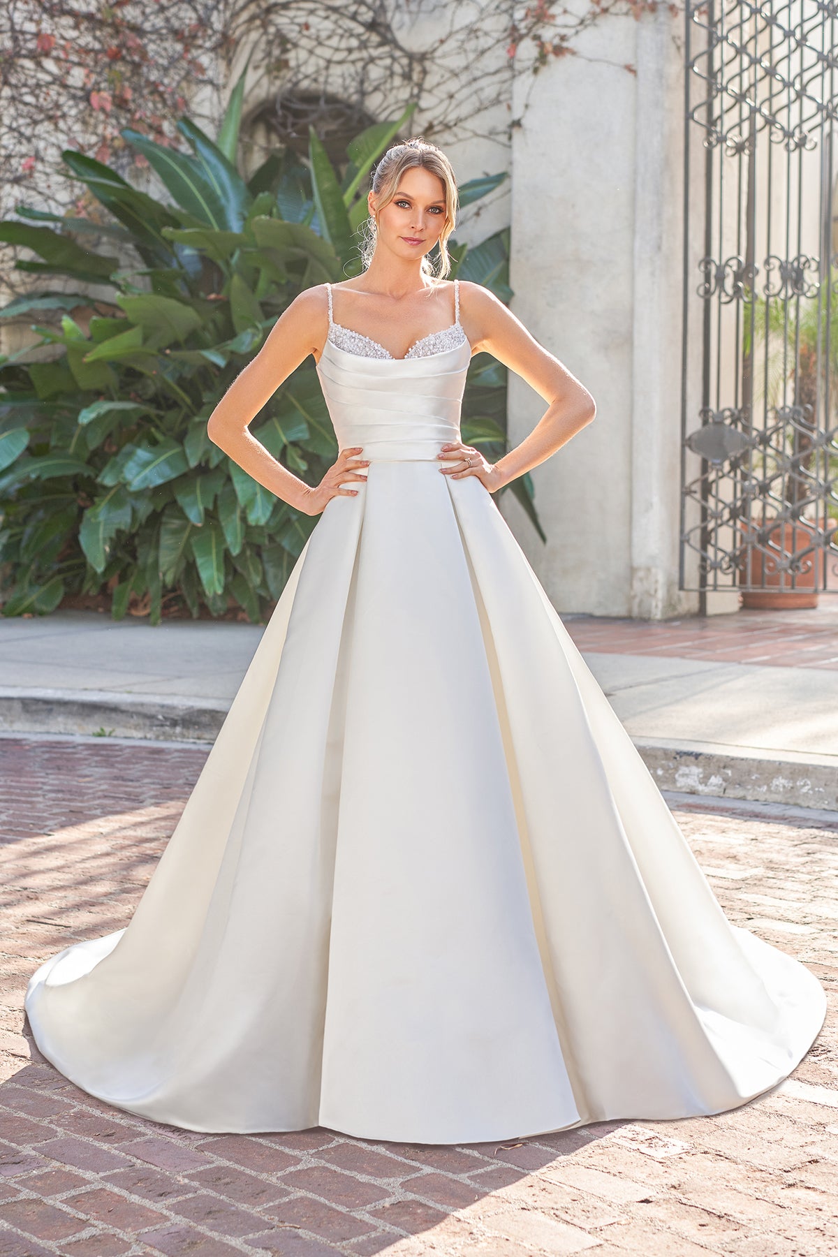 Thin shoulder strap with exposed back and floor length skirt with diamond stickers
