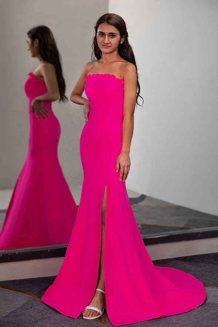 A fitted pleated waist cinched strapless side slit ball dress