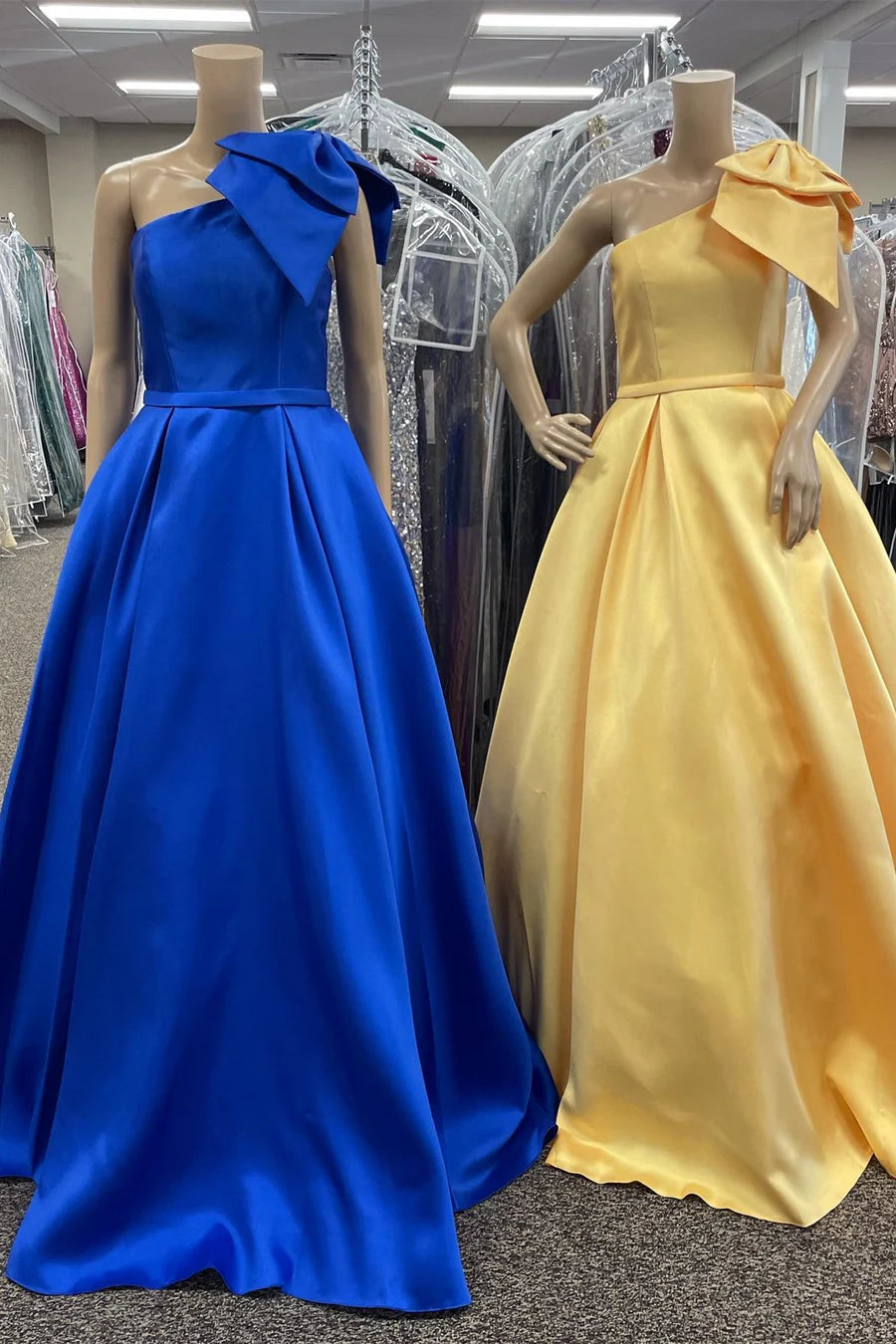 Single shoulder asymmetrical bow waist cinching long skirt