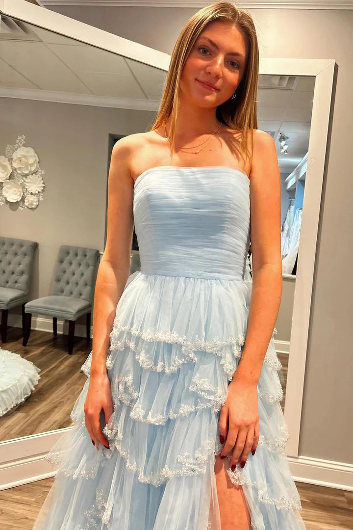 Strapless sleeveless pleated hem waist cinching side slit ballroom dress