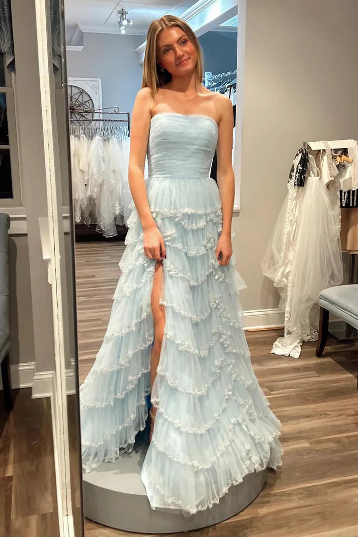 Strapless sleeveless pleated hem waist cinching side slit ballroom dress