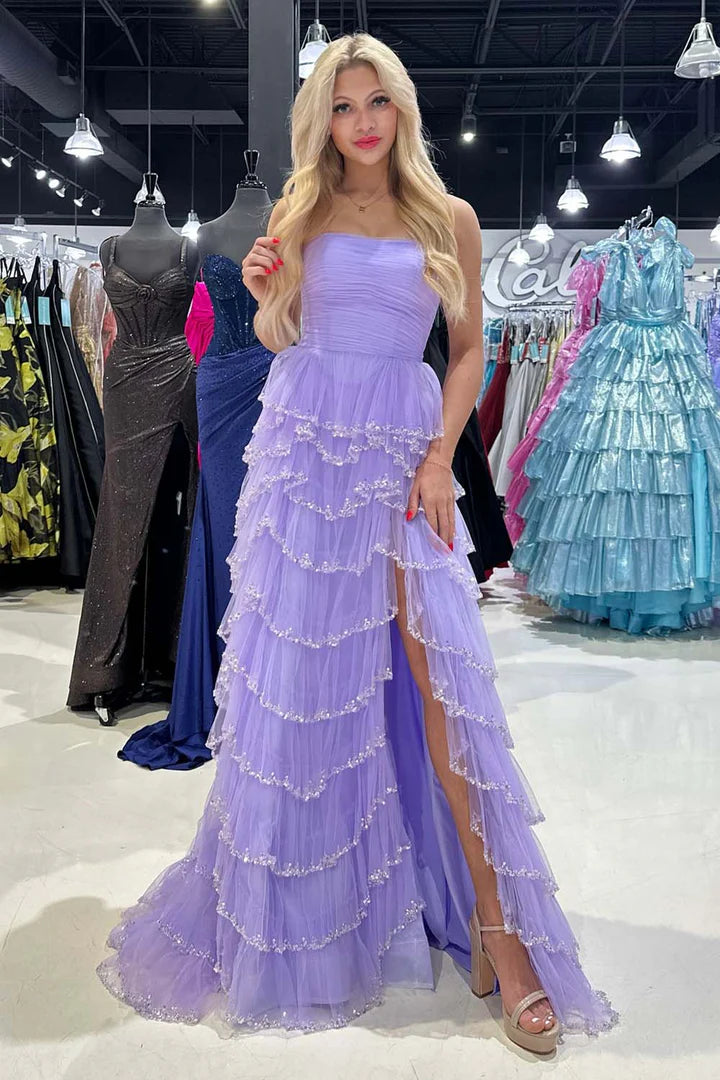 Strapless sleeveless pleated hem waist cinching side slit ballroom dress