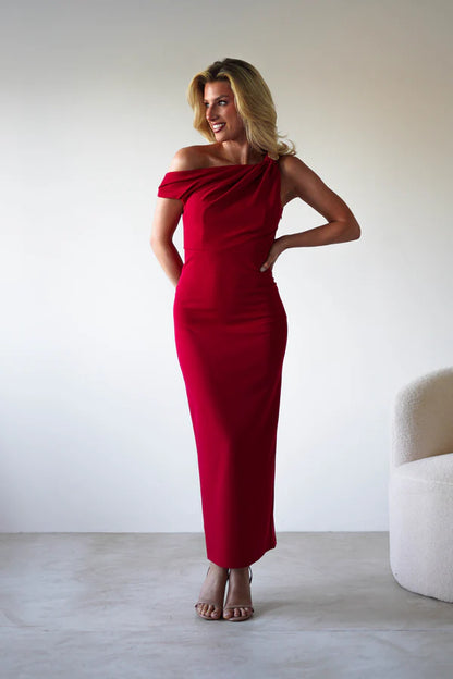 Red single room with waist cinching dress with a slit at the back