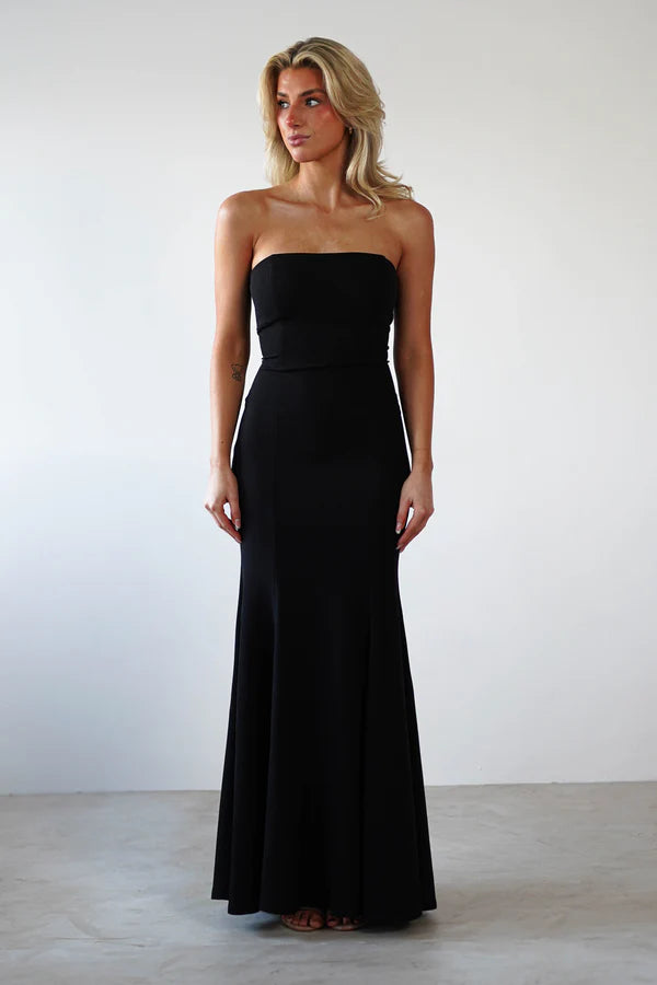 Sleeveless strapless tight fitting dress with exposed back