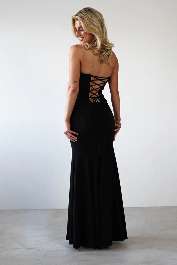 Sleeveless strapless tight fitting dress with exposed back