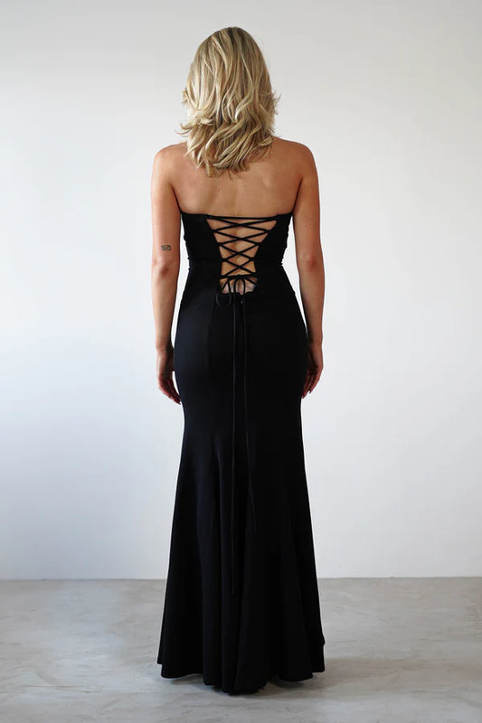 Sleeveless strapless tight fitting dress with exposed back