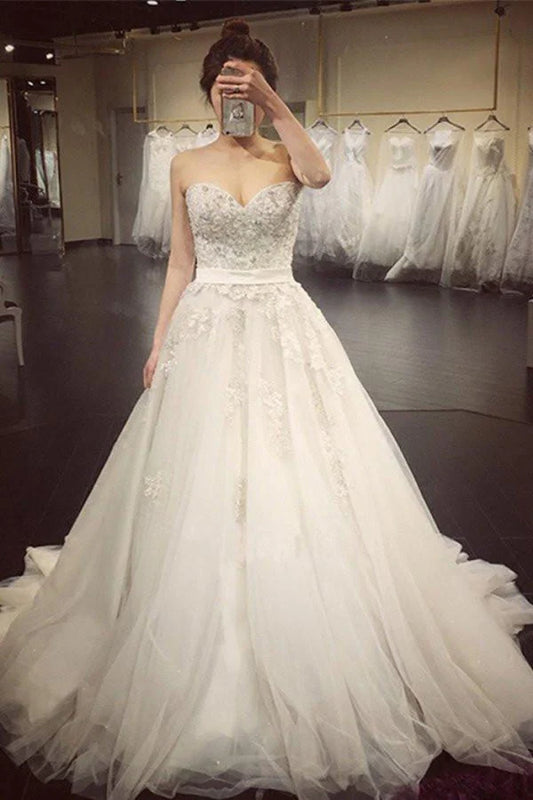 White A-line sweetheart sleeveless strapless beaded wedding dress