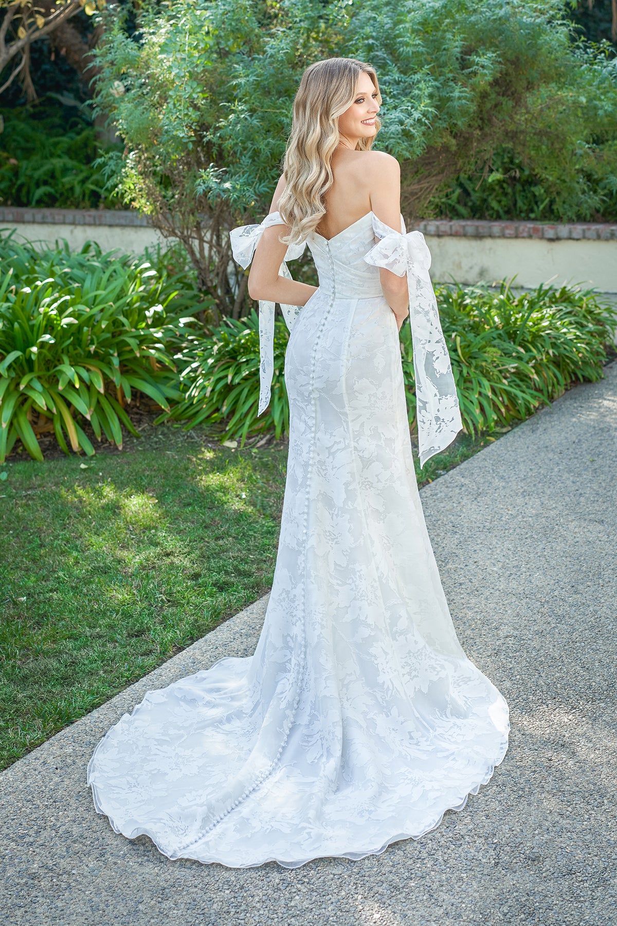 Strapless waist cinching lace bow and floor length skirt