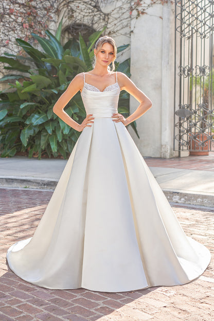 Thin shoulder strap with exposed back and floor length skirt with diamond stickers