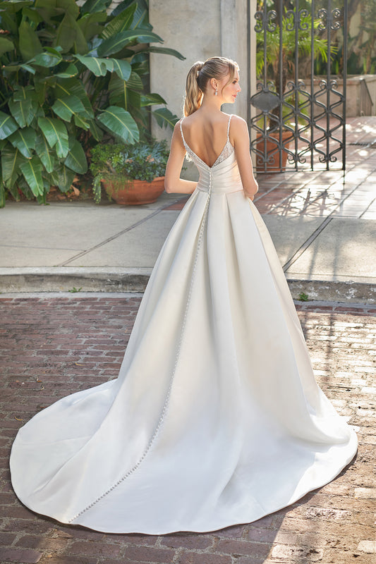 Thin shoulder strap with exposed back and floor length skirt with diamond stickers