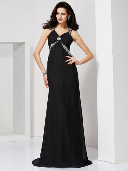 Tight fitting sleeveless halter dress with beaded backless design