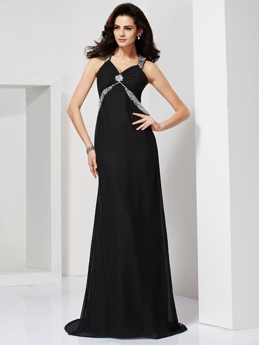 Tight fitting sleeveless halter dress with beaded backless design