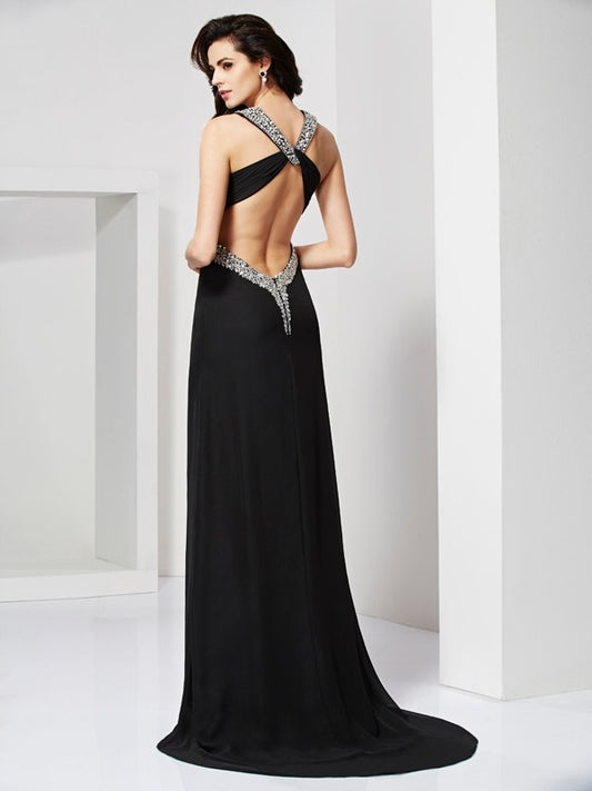 Tight fitting sleeveless halter dress with beaded backless design