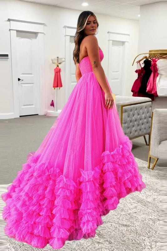 Hot pink strapless strapless ball gown with ruffled edges