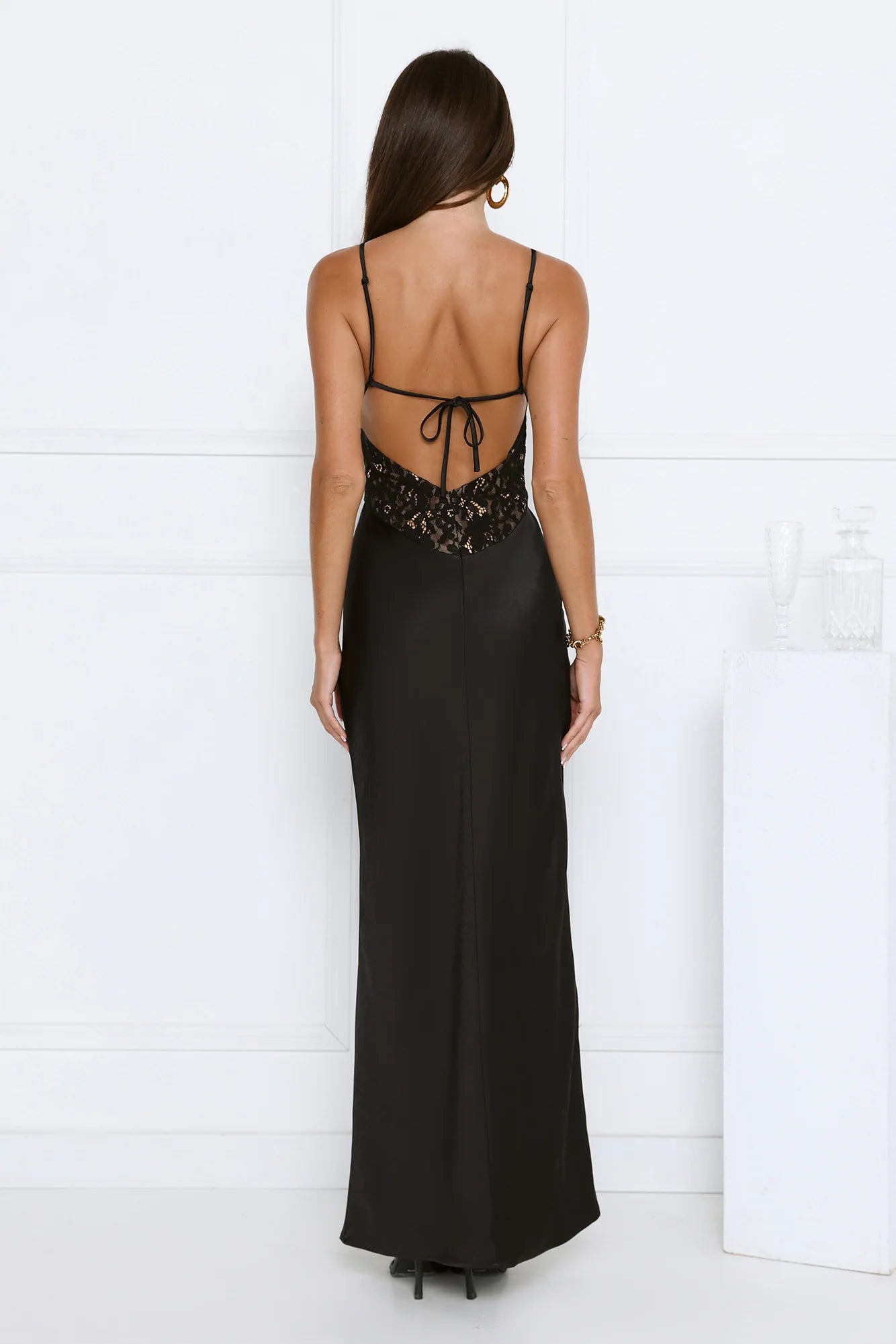 Alluring Black Satin Maxi Dress with Lace Bustier, Waist Cutout, Strappy Open Back Tie Closure and Floor-Length Silhouette