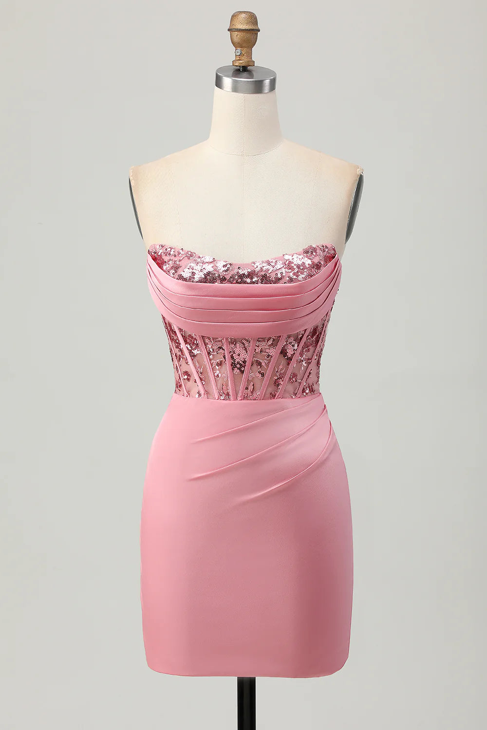 Blush strapless sequined homecoming dress on a model.