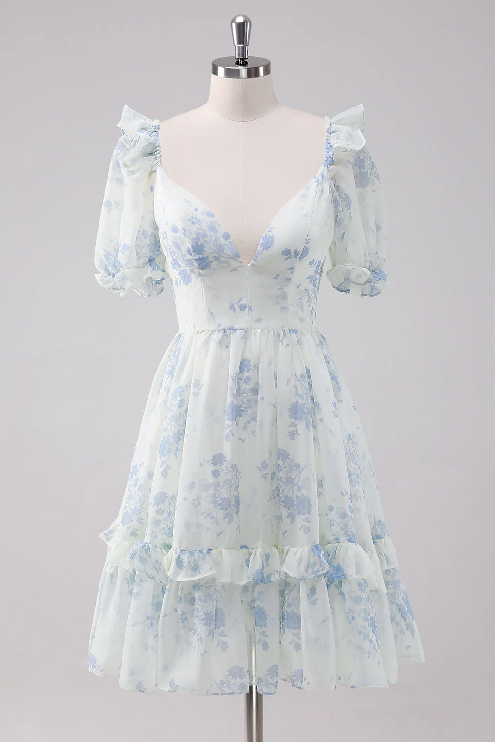 Light blue floral short dress with spaghetti straps, front view.