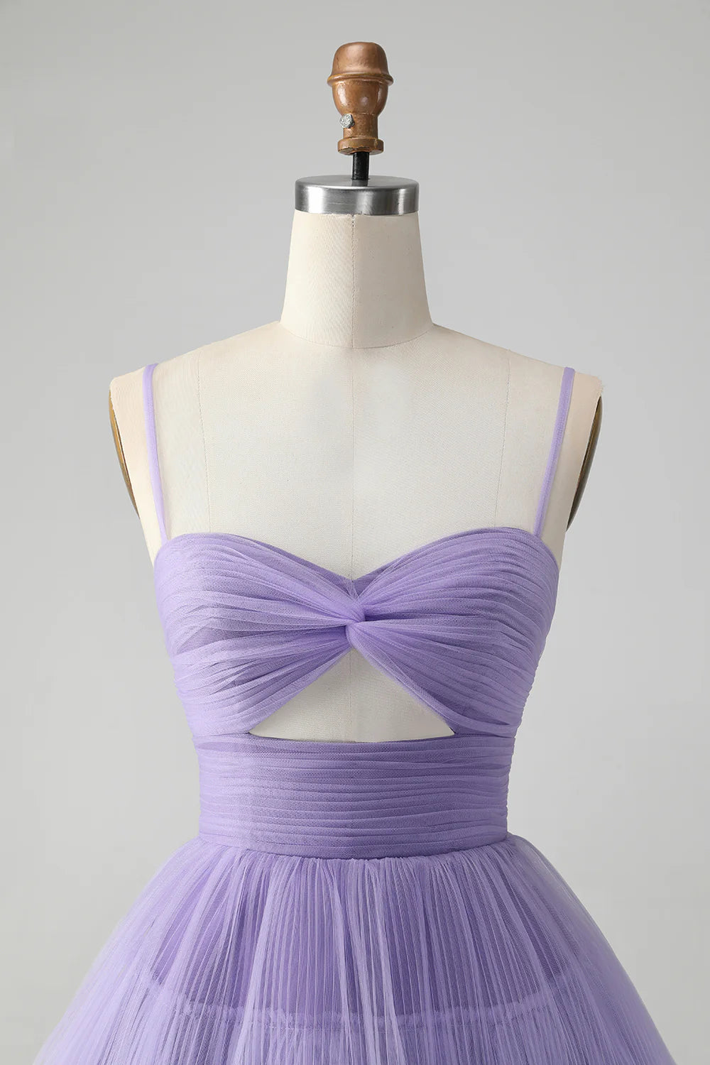 Side view of a purple A-line spaghetti strap dress, highlighting the short length.