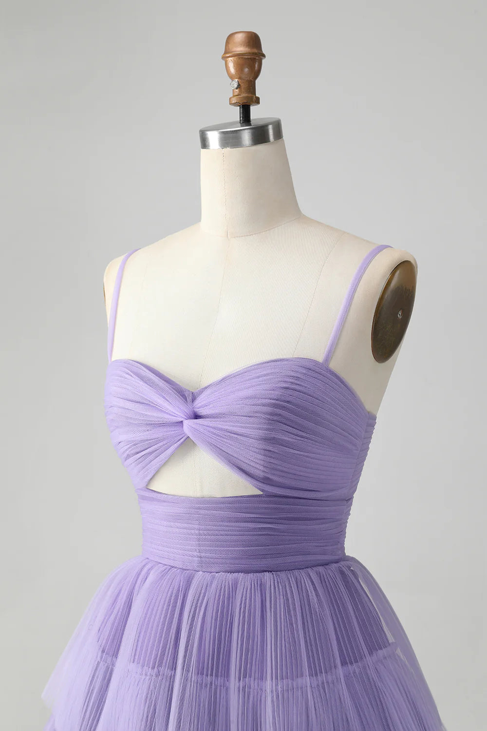 Detail of the spaghetti straps and neckline of the purple A-line dress.
