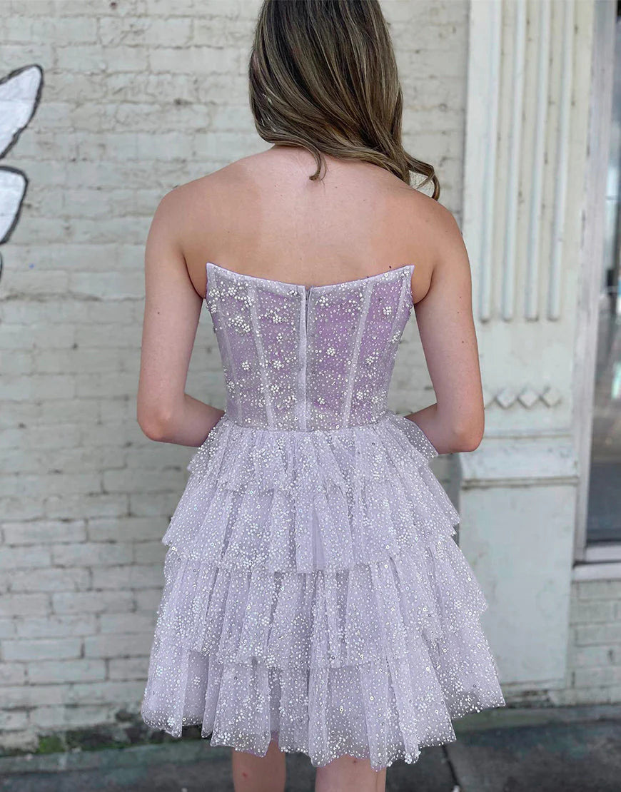 Back view of an A-Line strapless tiered tulle homecoming dress with zipper closure.