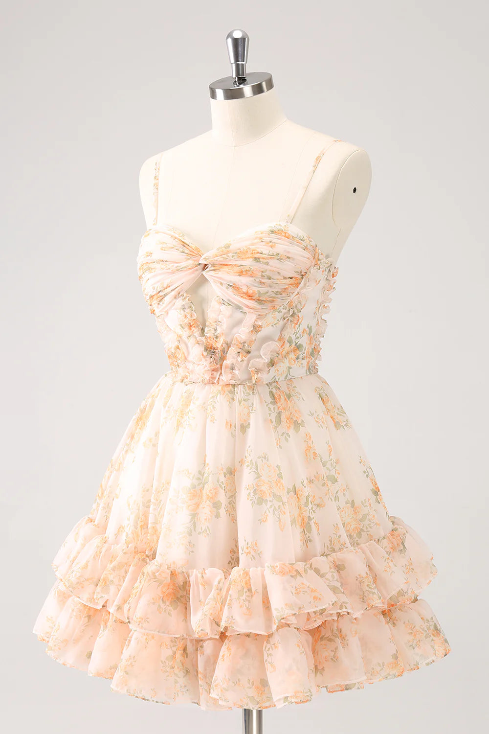 Side view of yellow tiered floral homecoming dress with ruffles.