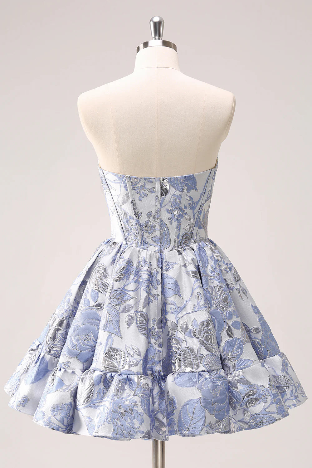 Side view of a blue A-line short homecoming dress with corset detail.