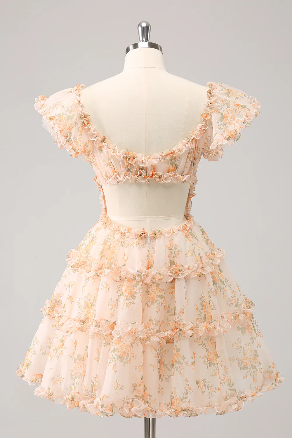 Back view of a yellow short homecoming dress showing corset lacing.