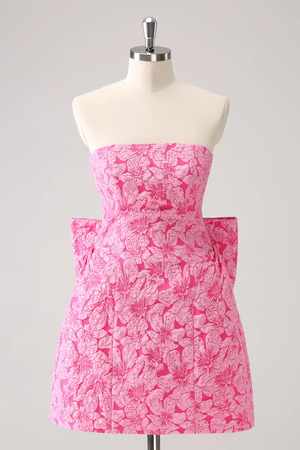 Hot pink A-line strapless short homecoming dress with bow detail.