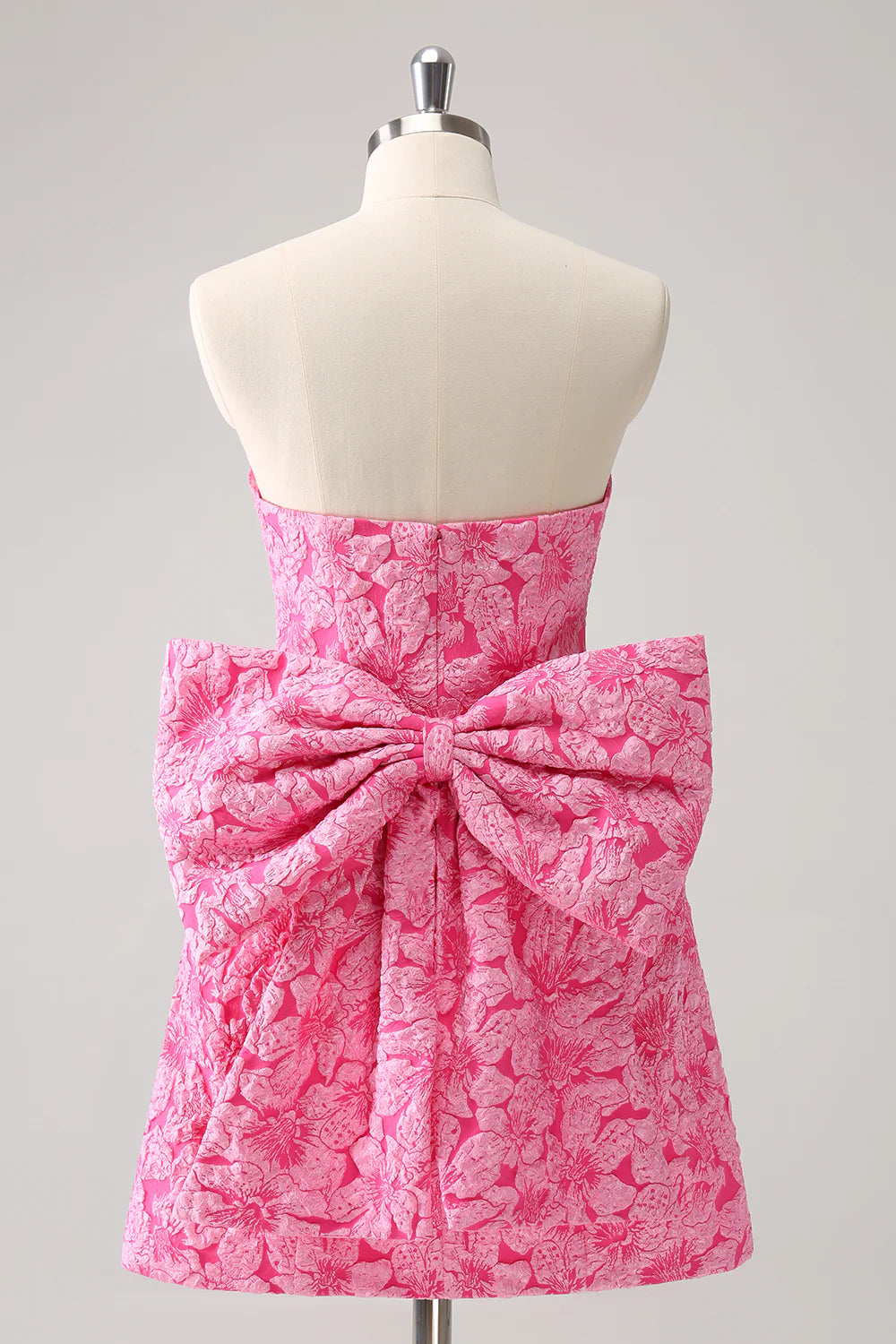 Side view of hot pink printed A-line strapless dress.