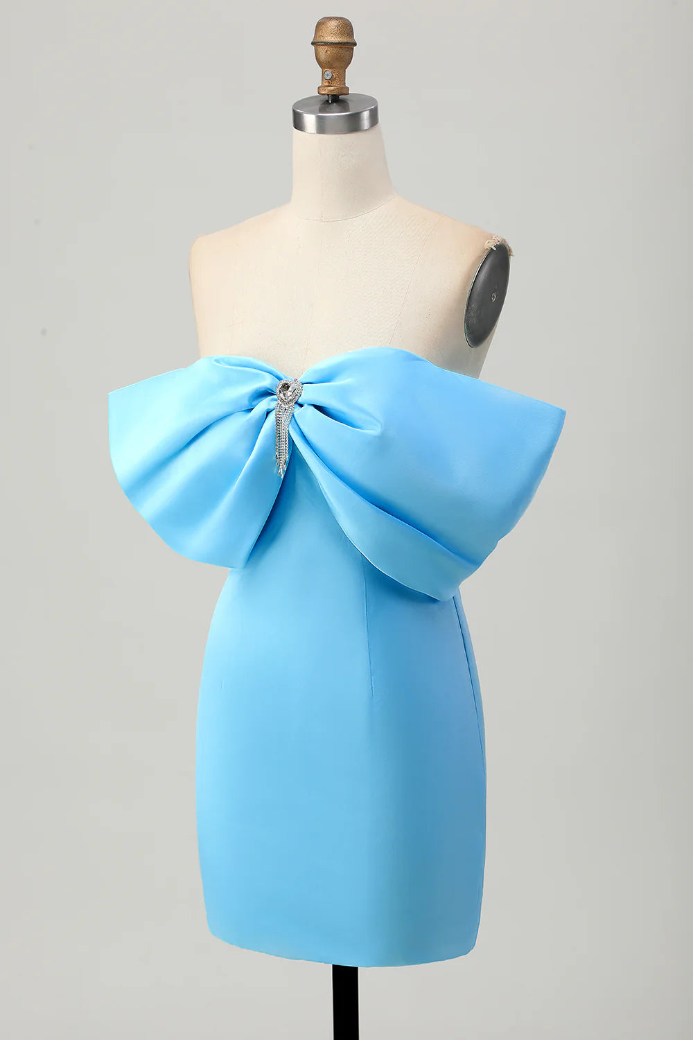 Close-up of the bow detail and off-shoulder neckline on the blue homecoming dress.