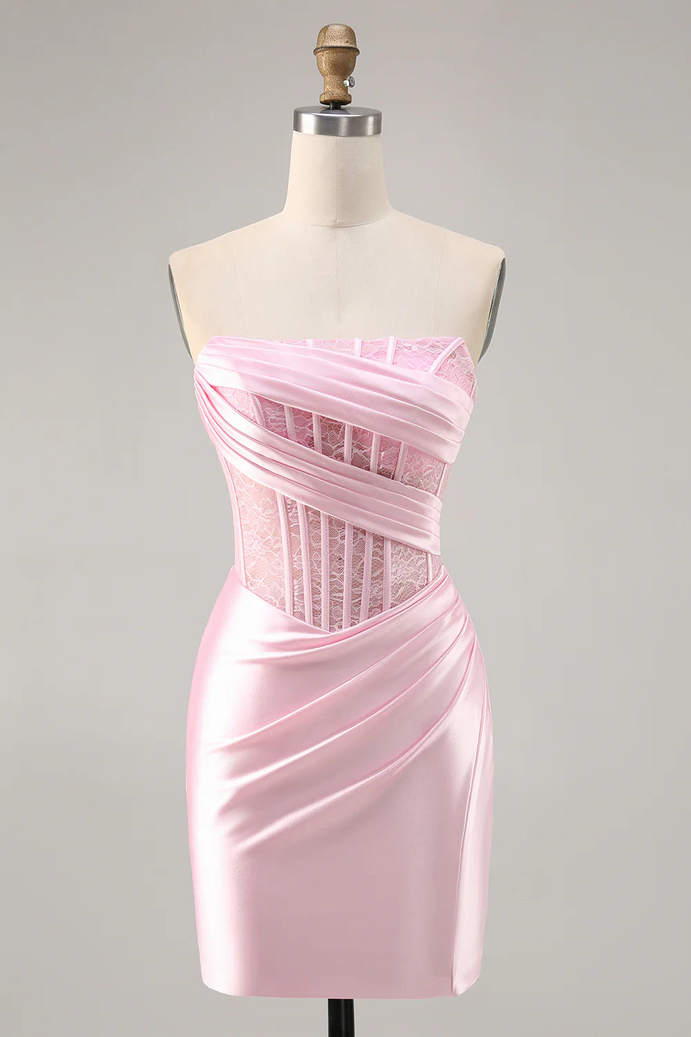 Pink satin bodycon homecoming dress with strapless corset and ruched details.
