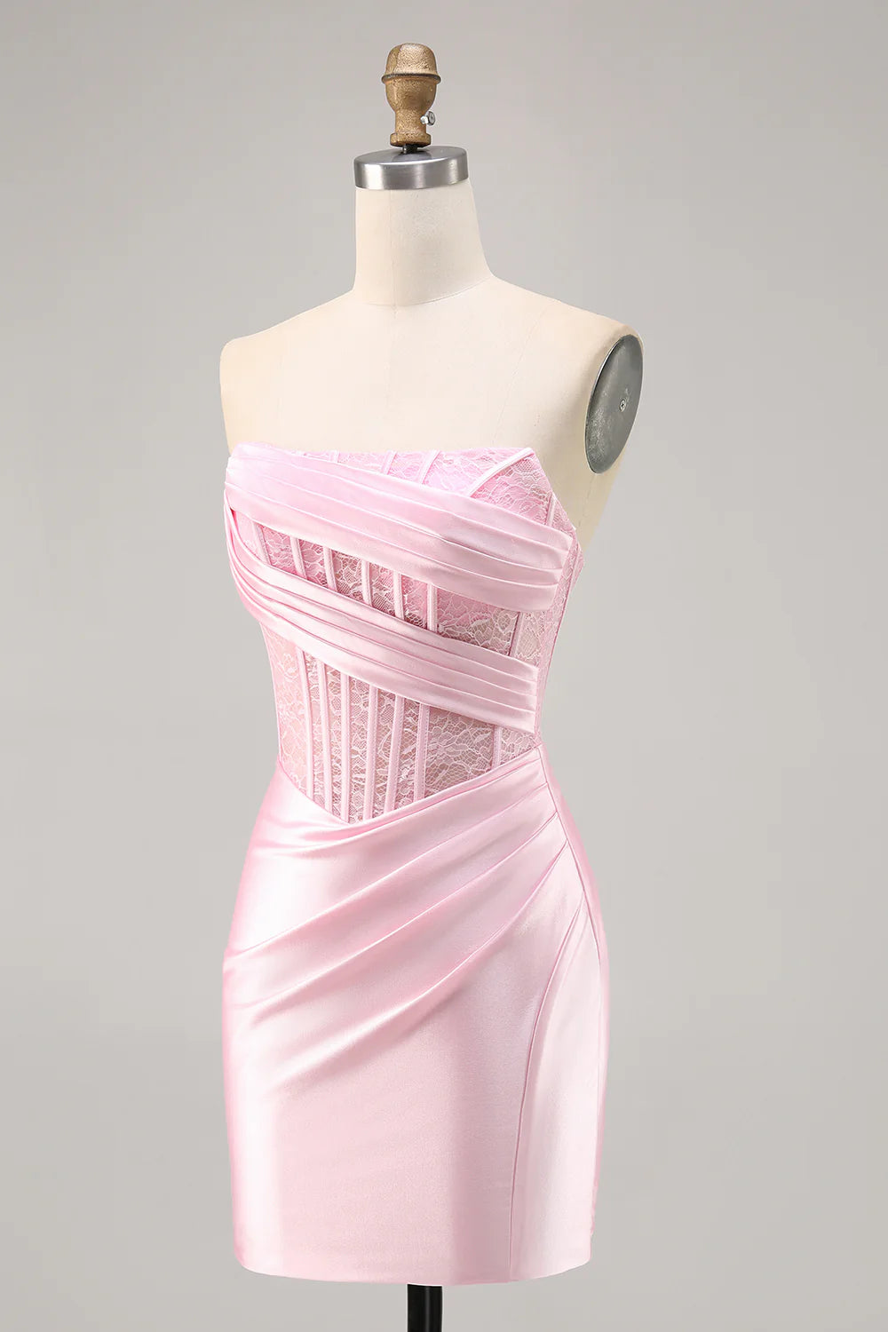 Side view of a model showcasing the elegant pink satin homecoming dress.