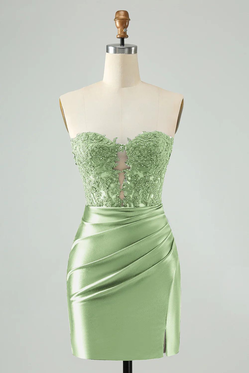 Green bodycon homecoming dress with sweetheart neckline and beaded corset.