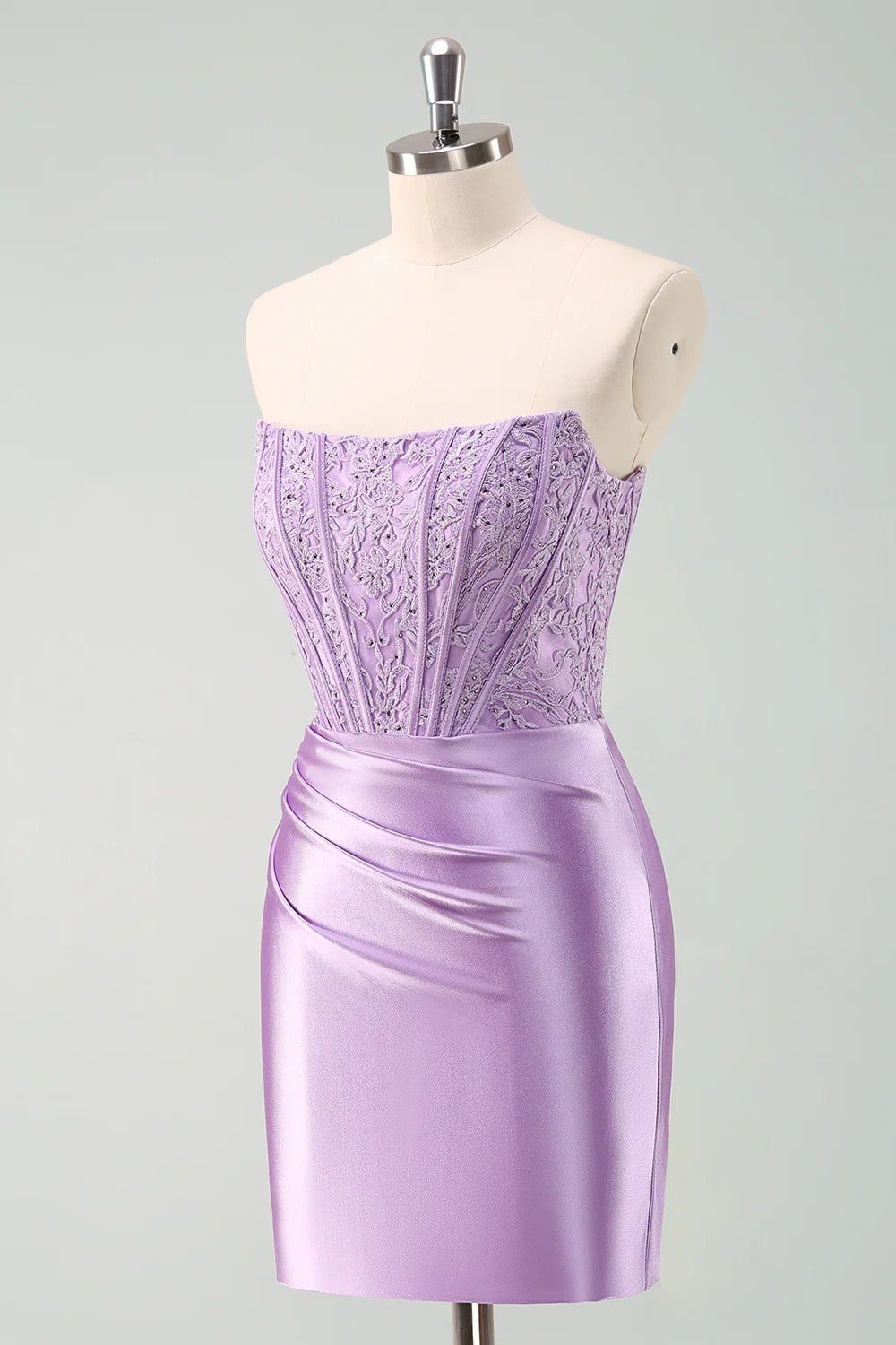 Close-up of the beaded corset and pleated detail on the purple homecoming dress.