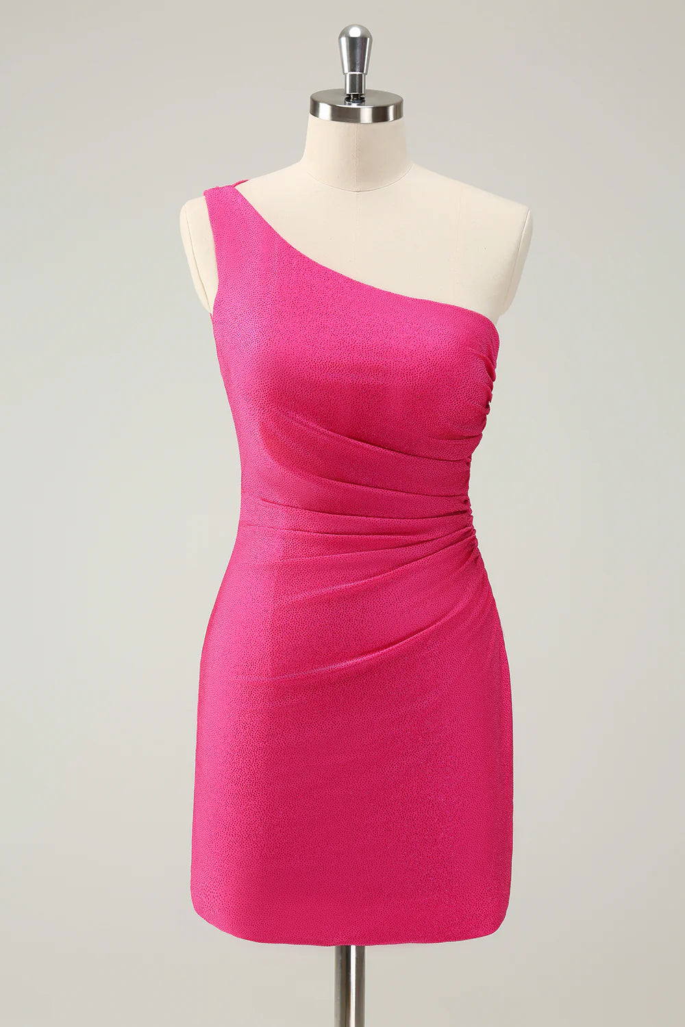 Model wearing a hot pink one-shoulder pleated short homecoming dress.