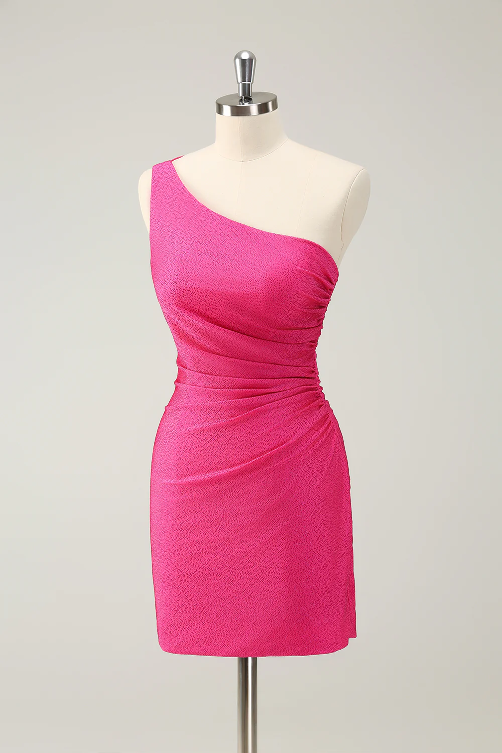 Side view of the hot pink one-shoulder pleated short dress.