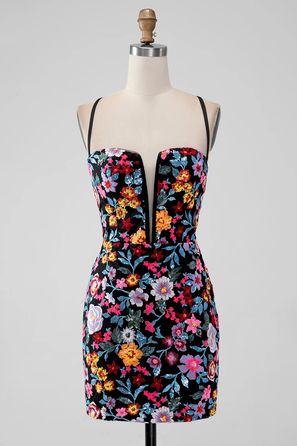 Black mermaid homecoming dress with spaghetti straps and floral embroidery.