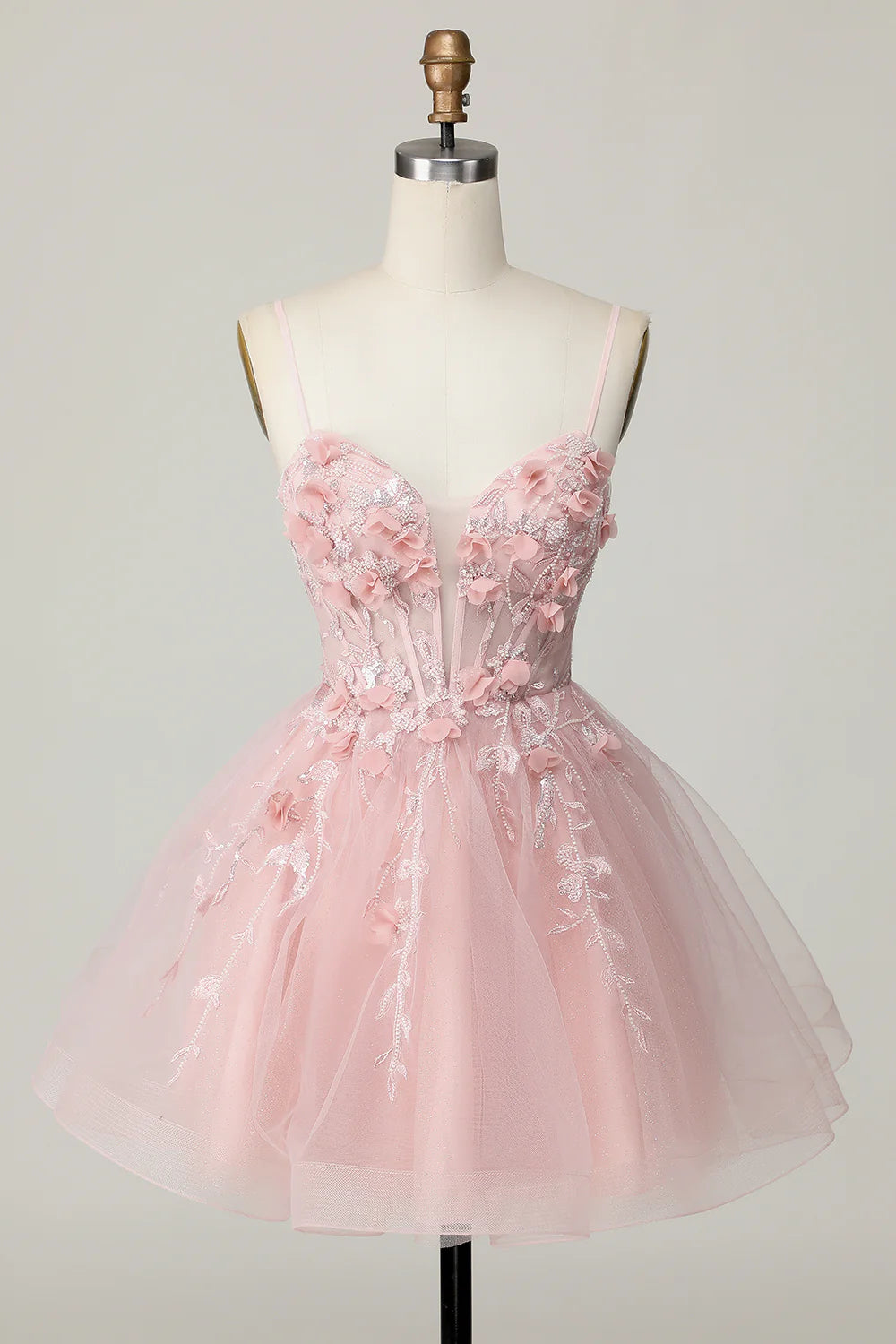 Pink A-line strapless homecoming dress with tulle, beading, and 3D flowers.