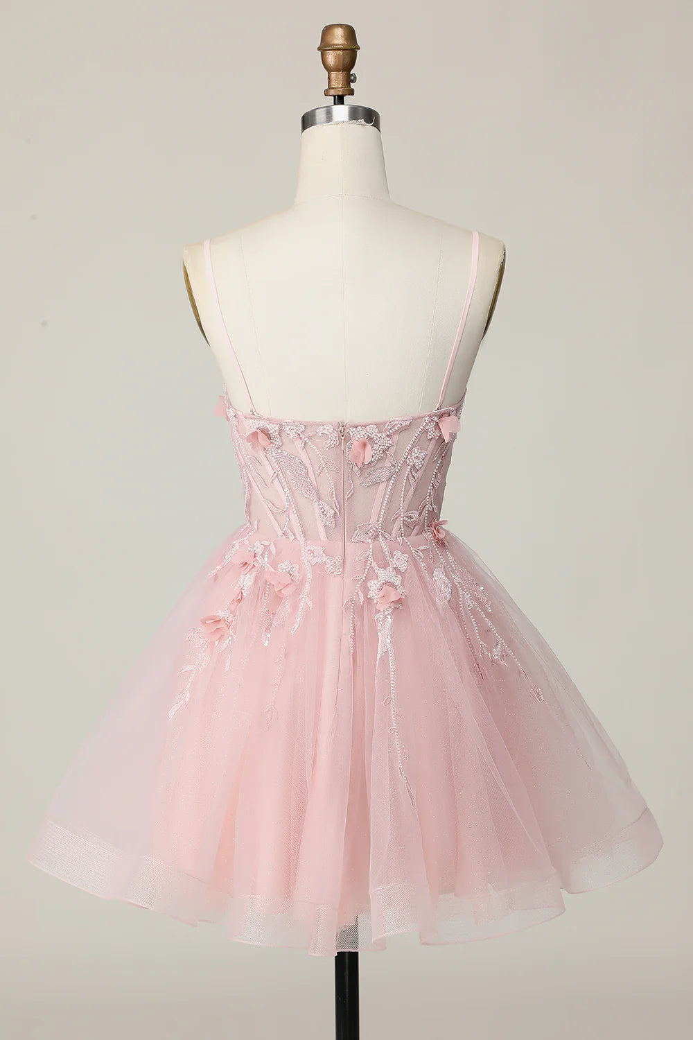 Back view of pink A-line strapless homecoming dress with corset detail.