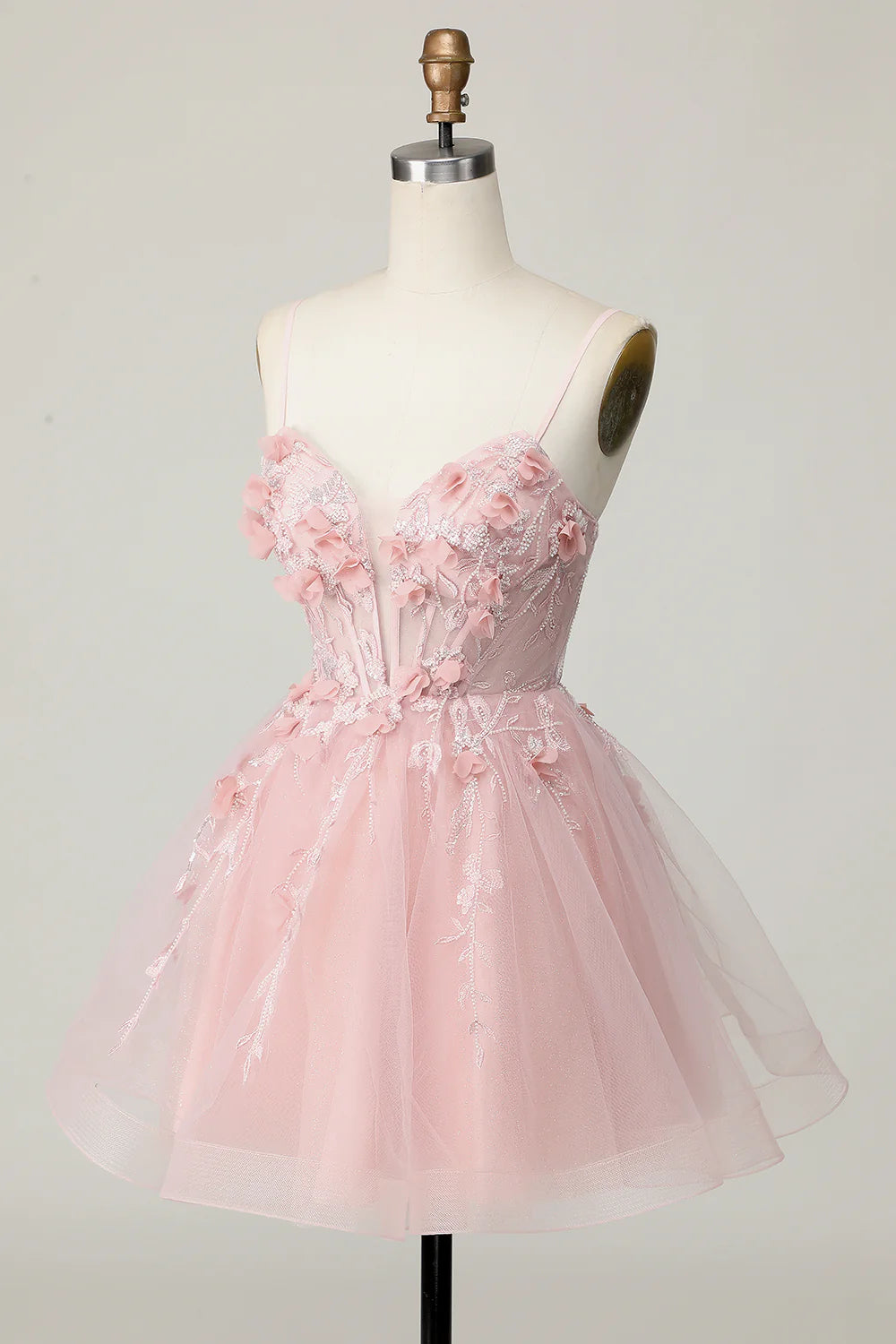 Close-up of 3D flowers and beading on pink tulle homecoming dress.