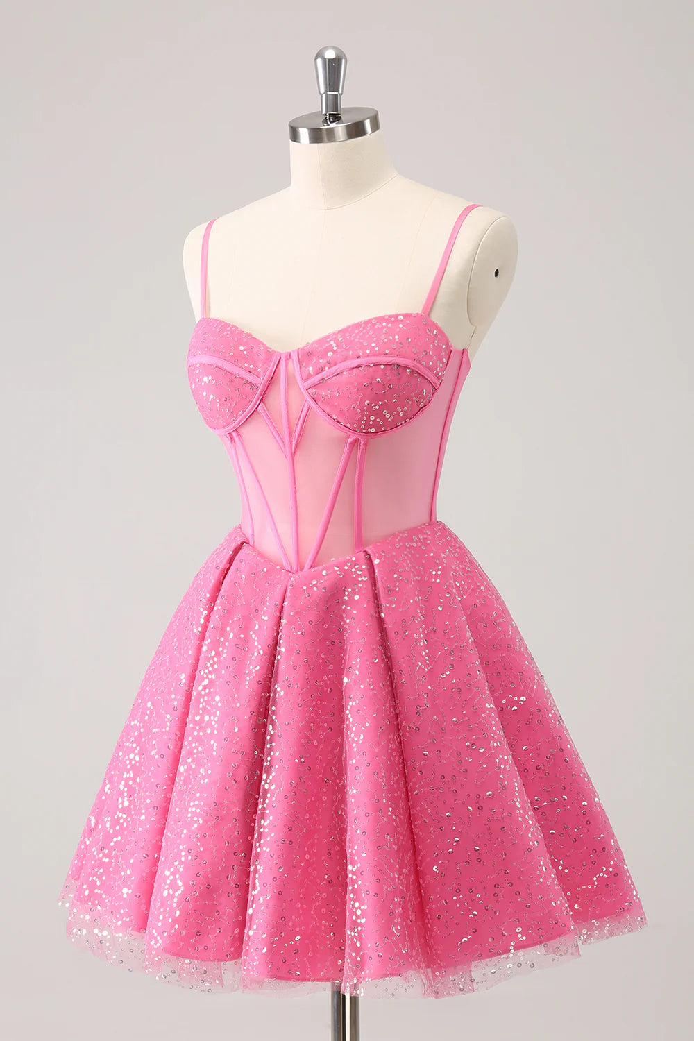 Full view of the sparkly pink A-line short homecoming dress from the back, highlighting the silhouette.