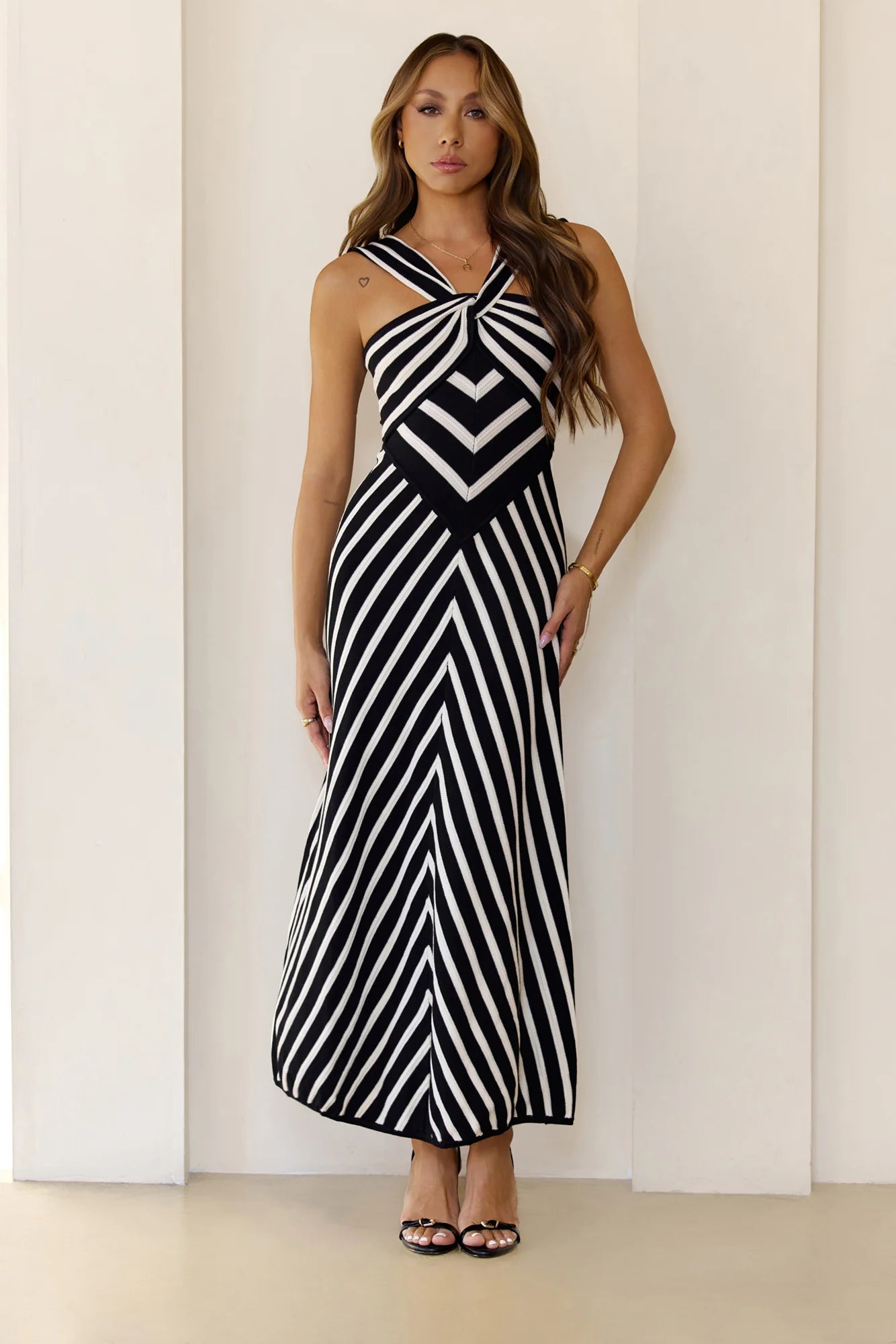 Chic Black White Stripe Knit Maxi Dress - Cross Halter Neck, Chevron Waist Detail, Flared A-Line Skirt & Square Open Back - Modern Retro Sundress for Cocktail Parties, Date Nights & Spring Events