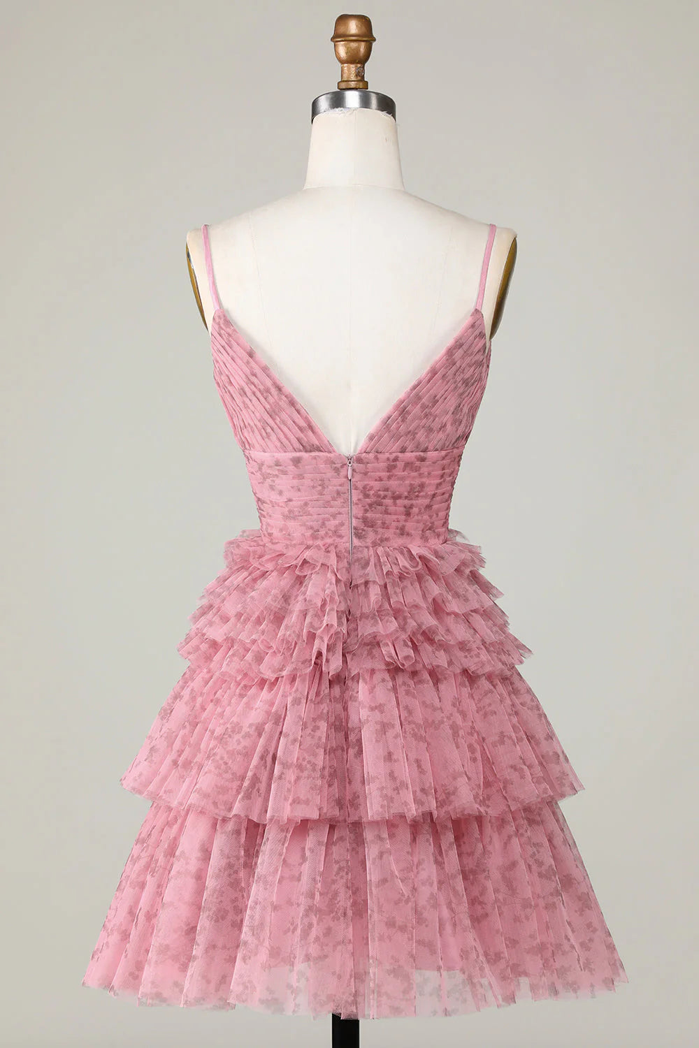 Back view of blush A-line short homecoming dress with spaghetti straps.