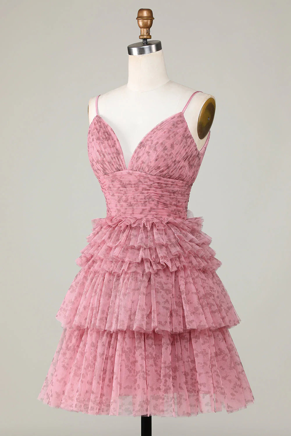 Side view of blush A-line short homecoming dress with ruffles.