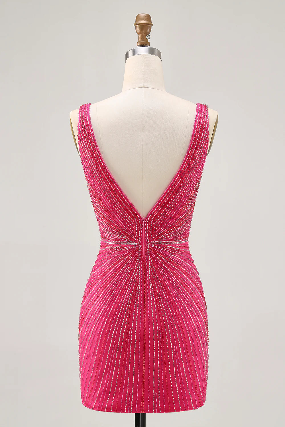 Fuchsia bodycon V-neck backless short homecoming dress with beading, side view.