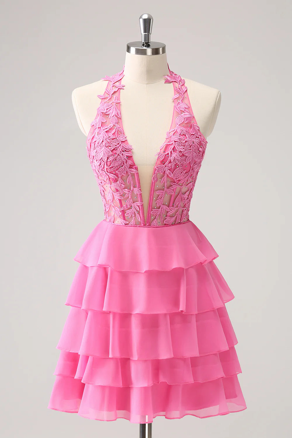 Model wearing a dazzling hot pink strapless A-line tiered ruffle homecoming dress with beading.