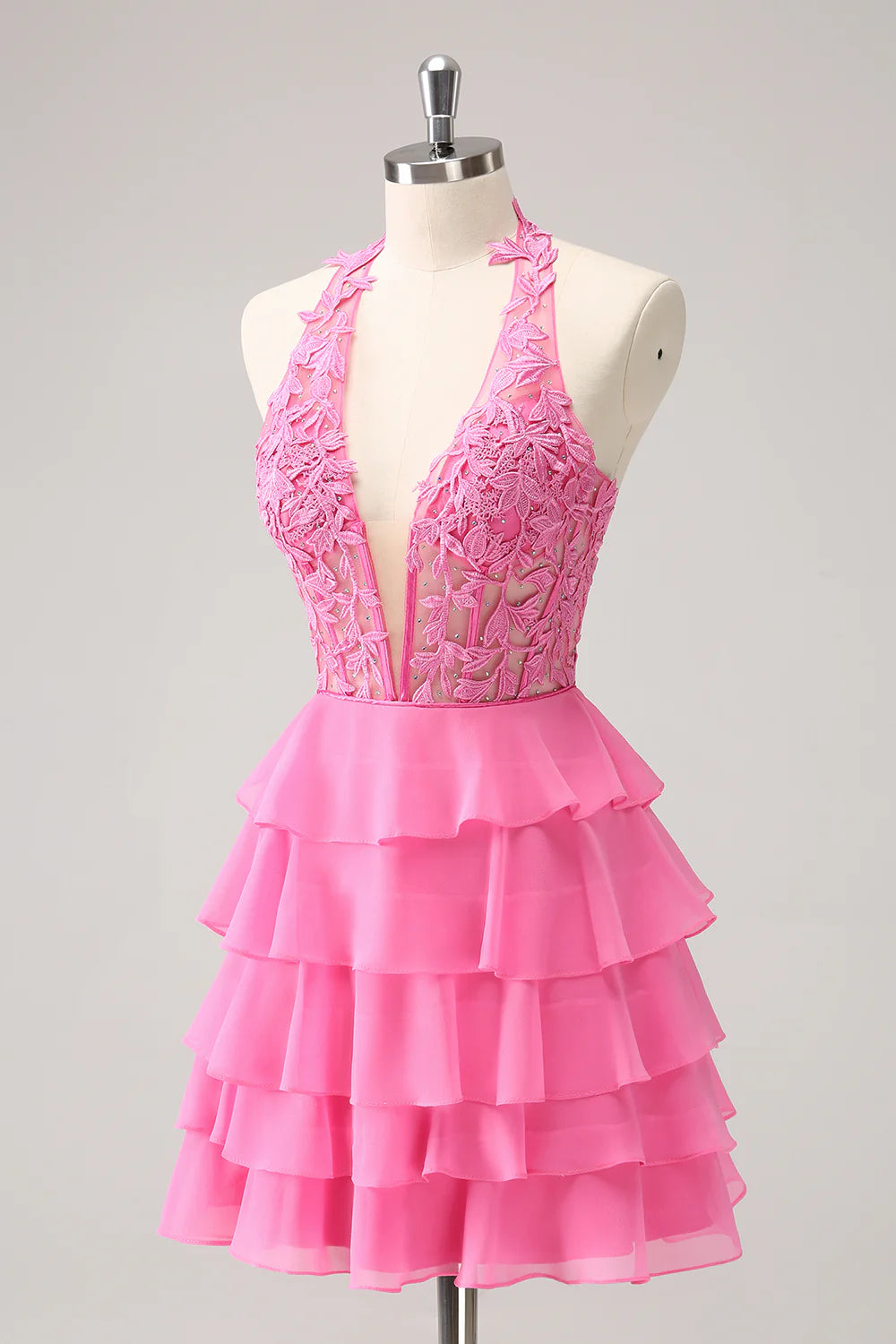 Back view of the hot pink strapless A-line homecoming dress, showcasing the corset detail.