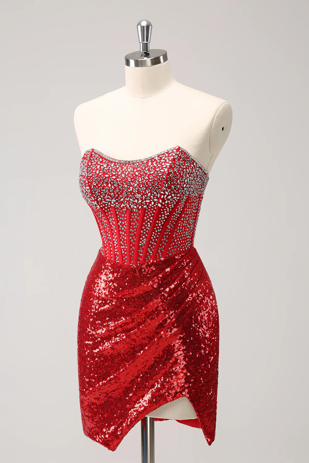 Side view of a red sequin short dress, highlighting the slit.