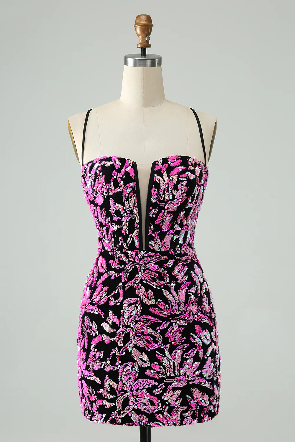 Model wearing a fuchsia black sparkly sequin bodycon short homecoming dress.